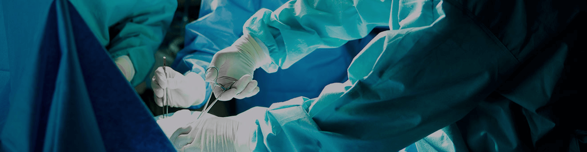 Surgical team operates in sterile room with precise tool use; focused hands in blue gowns.